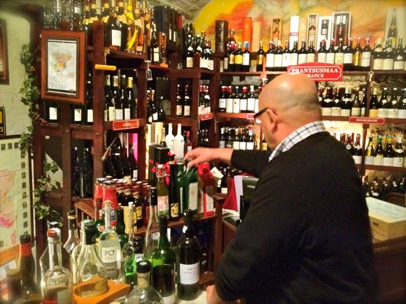 Dimitri Demjanov selects wine at Gloria Wine Cellar